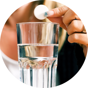 a hand holding a pill over IV-Therapy in Costa Mesa, CA