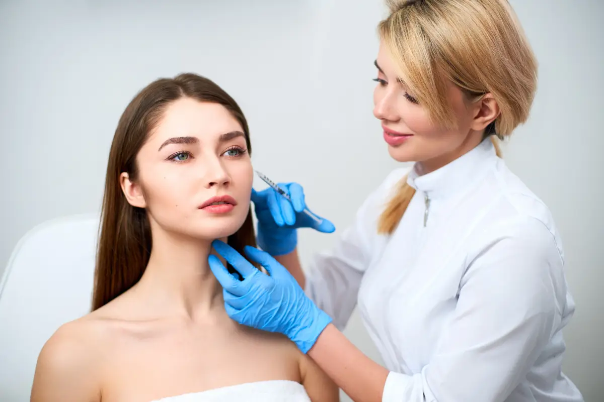 a woman getting a facial injection in Costa Mesa, CA