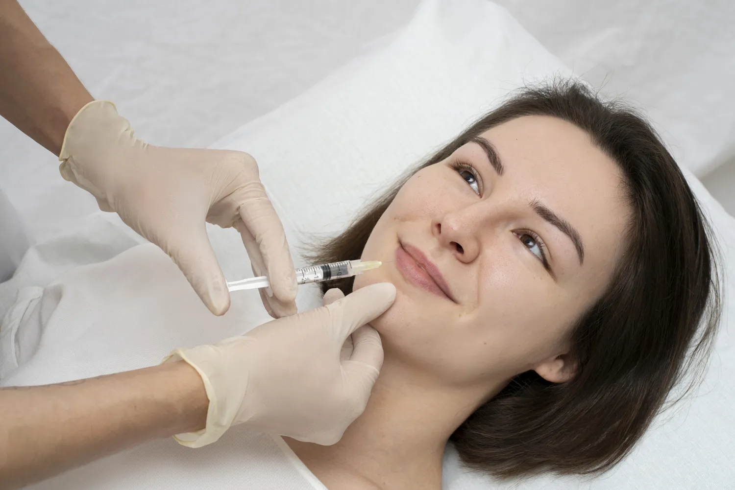 A woman receiving a Botox injection in Costa Mesa, CA