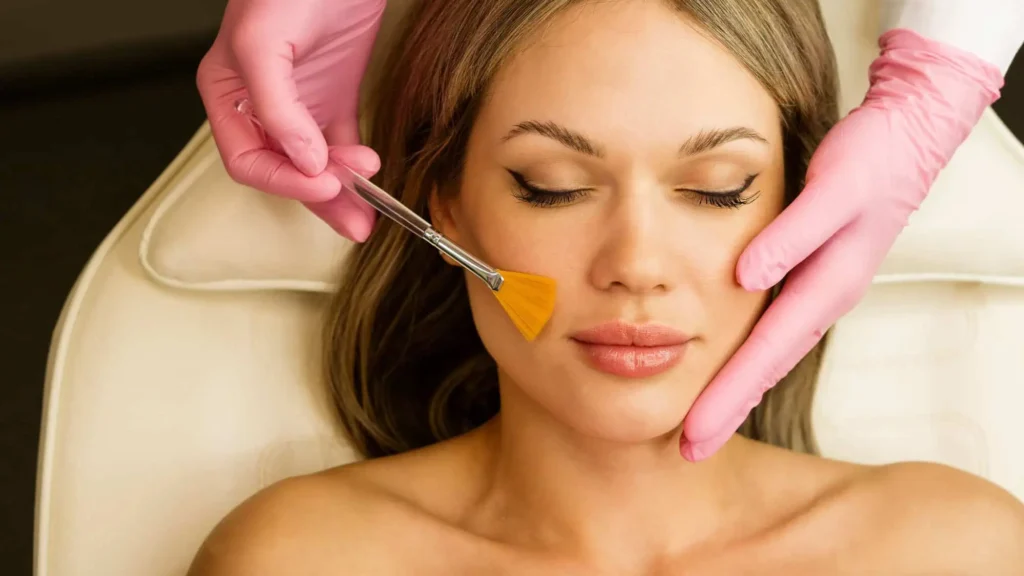 a woman getting a face mask treatment in Costa Mesa, CA